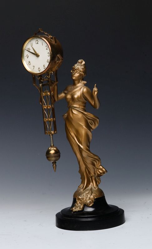 A MID 20TH CENTURY FIGURAL SWINGER CLOCK