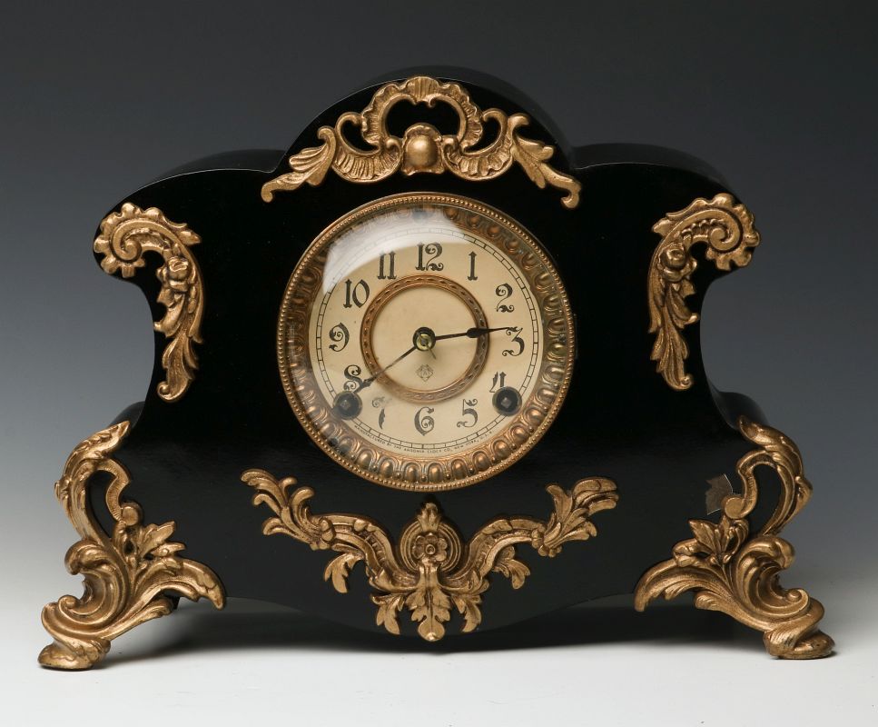 AN ANSONIA 'AMIENS' IRON MANTLE CLOCK