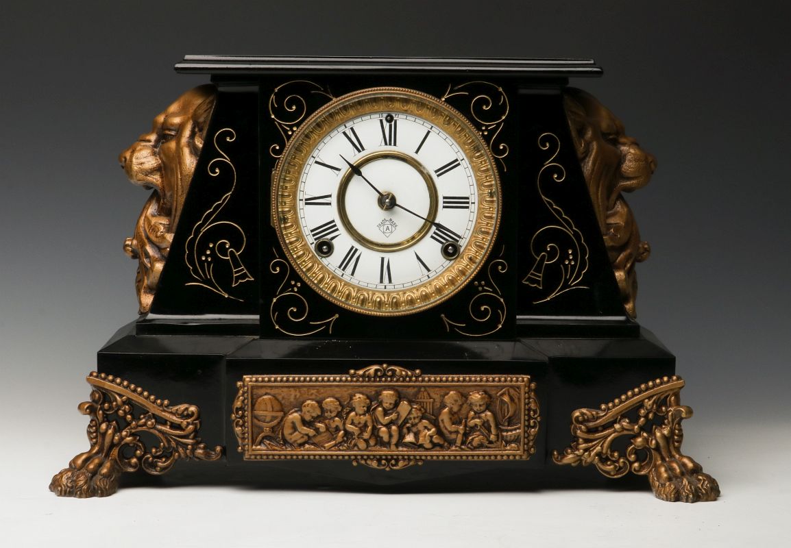 AN ANSONIA 'NUBIA' ENAMELED IRON MANTLE CLOCK