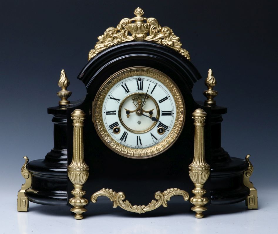 AN ANSONIA BLACK ENAMELED SHELF CLOCK