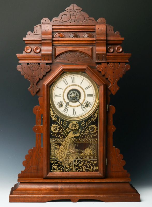 AN INGRAHAM ORNATE WALNUT PARLOR CLOCK