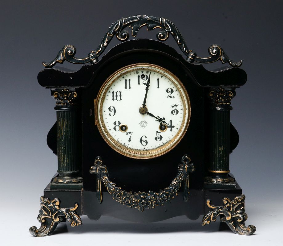 AN ANSONIA 'TOULON' ENAMELED IRON MANTLE CLOCK