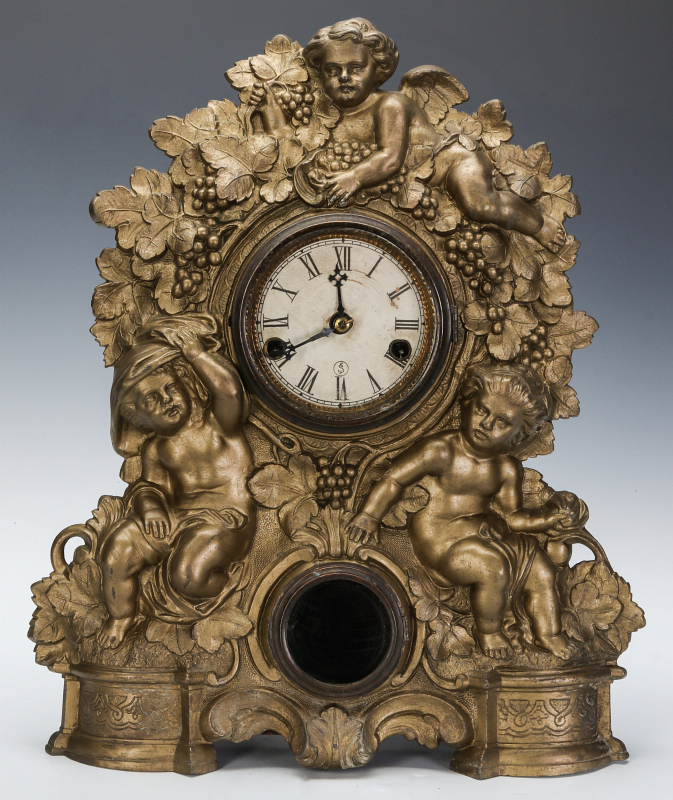 A NICHOLAS MULLER CAST IRON CLOCK WITH PUTTI