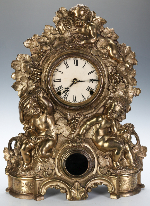 A NICHOLAS MULLER CAST IRON CLOCK WITH PUTTI