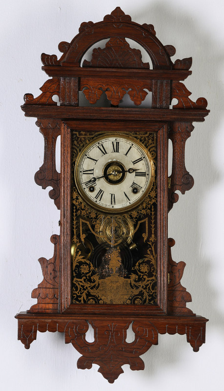 AN E.N. WELCH ORNATE WALNUT HANGING PARLOR CLOCK