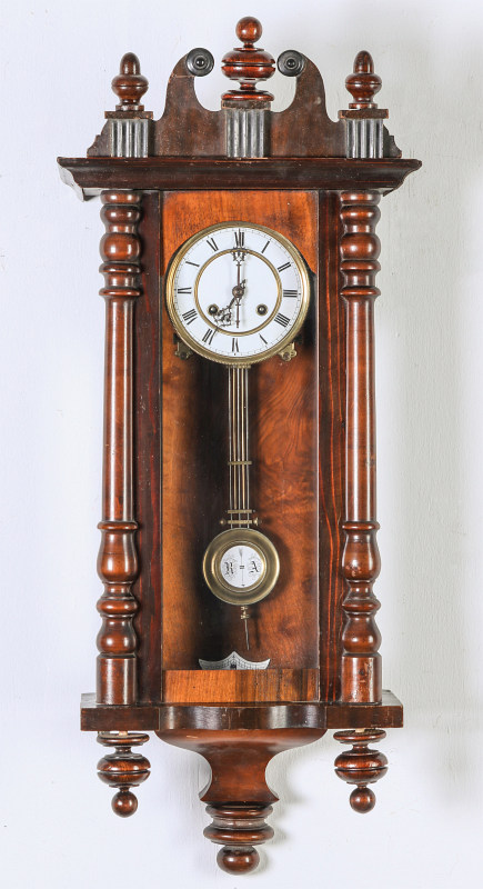 AN ORNATE WALL REGULATOR WITH RA PENDULUM