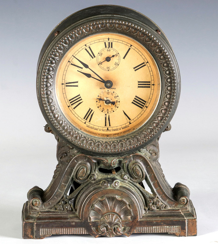 A SETH THOMAS METAL CASE LONG ALARM SHELF CLOCK