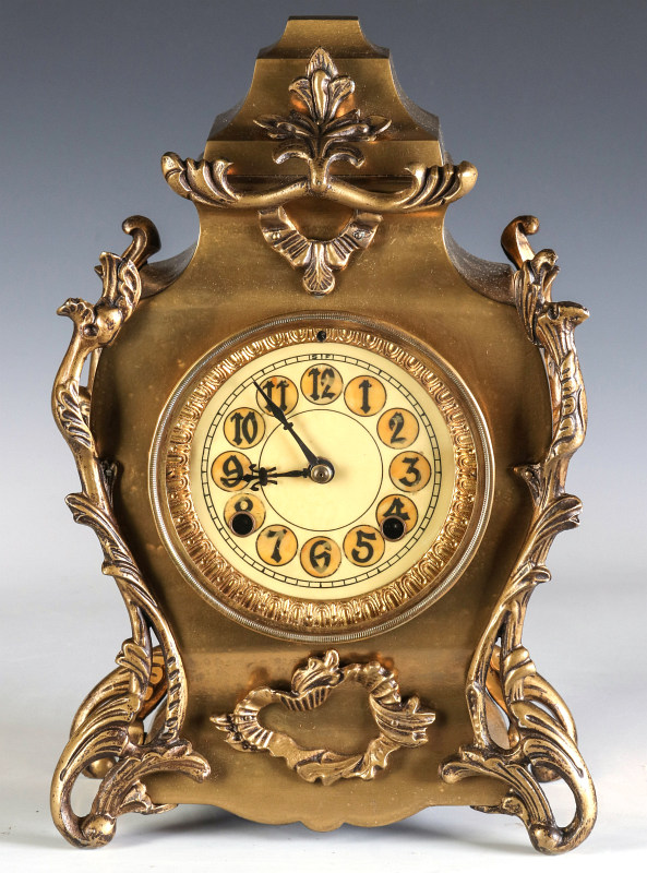 AN ORNATE NEW HAVEN BRASS CASE CLOCK