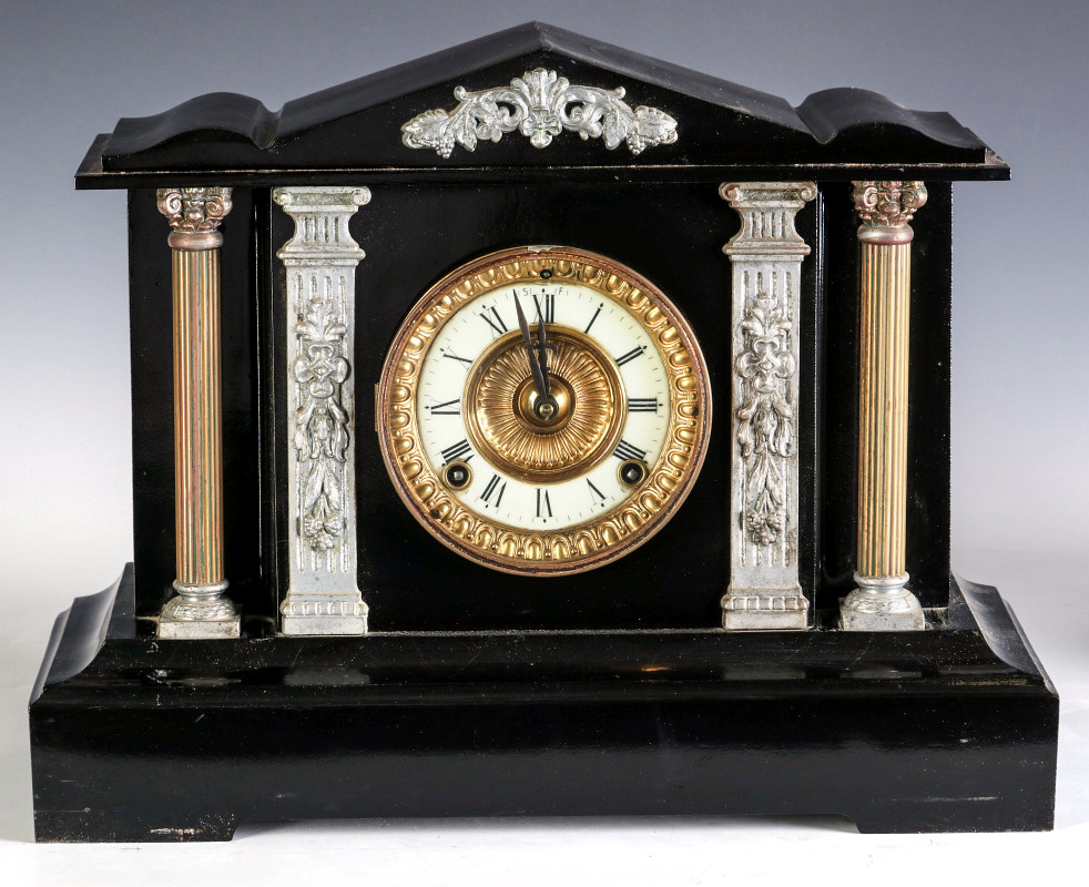 AN ANSONIA 'CORINTH' IRON CLOCK WITH HALF COLUMNS