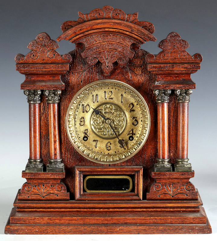 AN INGRAHAM OAK CASE CABINET NUMBER 7 SHELF CLOCK