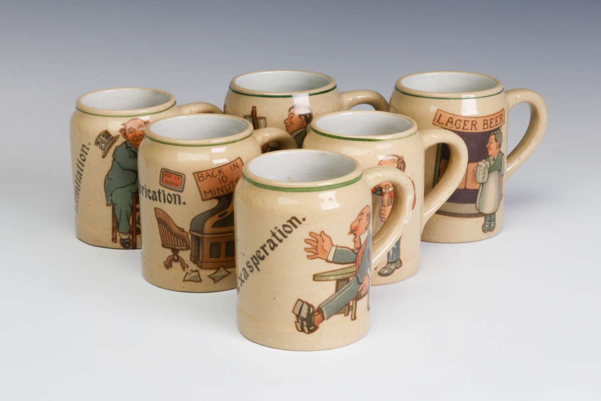 SIX PRE-PROHIBITION GERMAN POTTERY CHARACTER MUGS