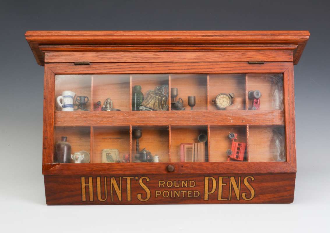 A CIRCA 1900 OAK ADVERTISING CASE FOR HUNT'S PENS