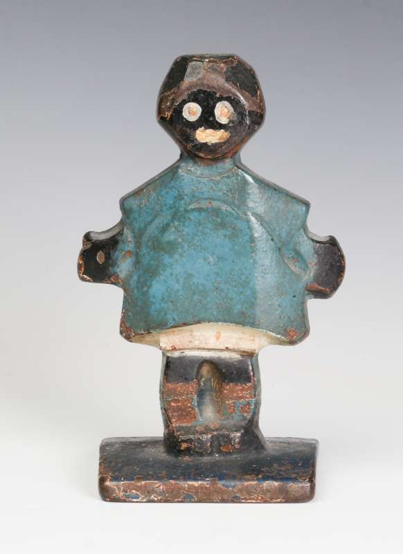 AN UNUSUAL BLACK AMERICANA CAST IRON DOOR STOP