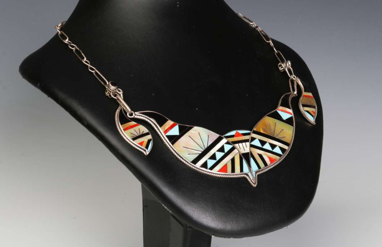 A ZUNI STERLING PENDANT WITH SEMI PRECIOUS INLAY