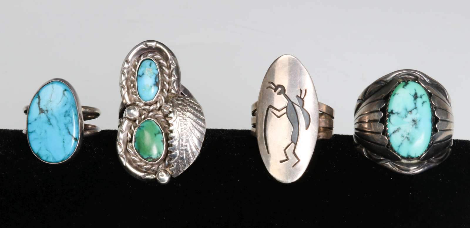 FOUR NAVAJO STERLING AND TURQUOISE RINGS