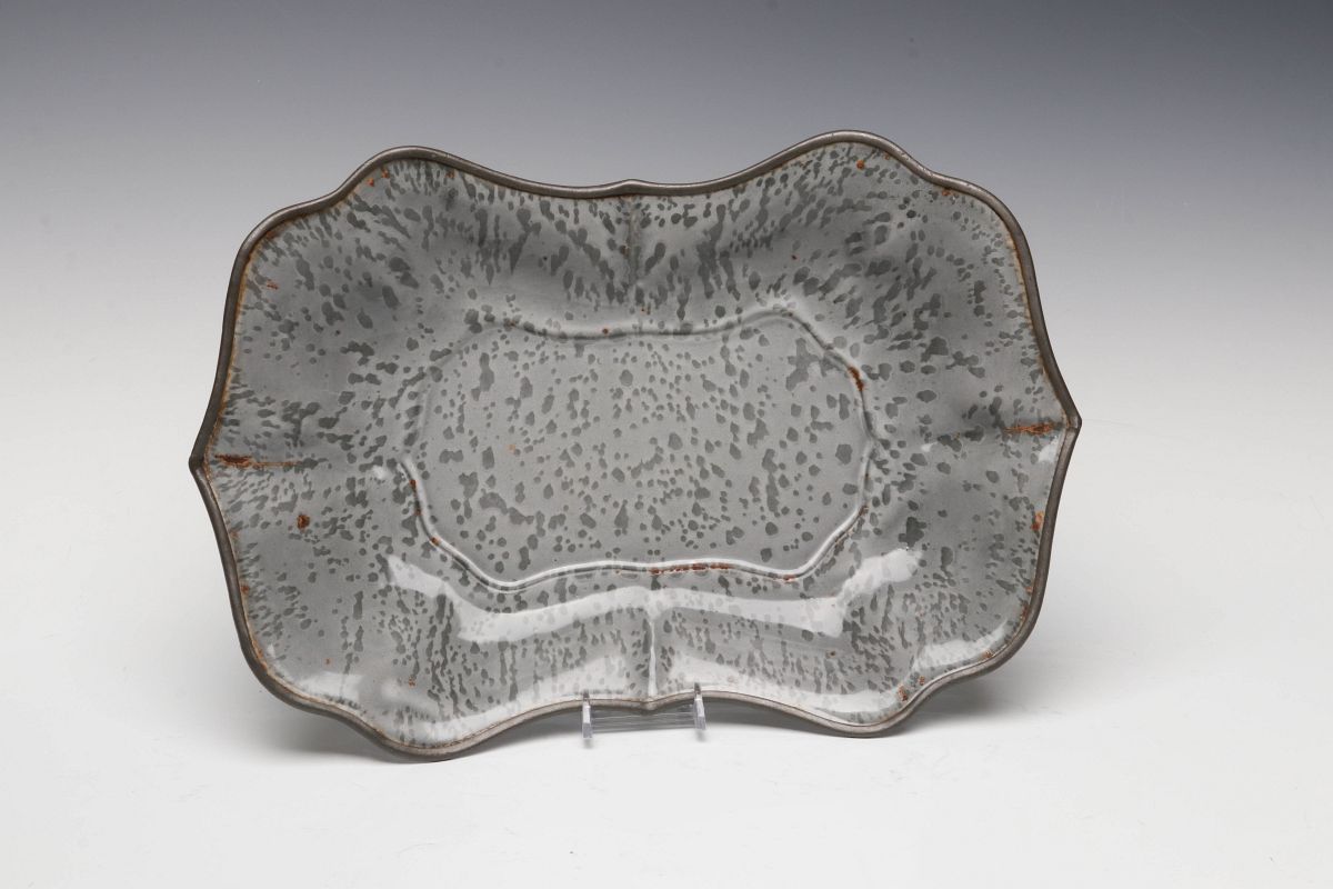 AN UNUSUAL MOLDED GRAY GRANITE BREAD TRAY