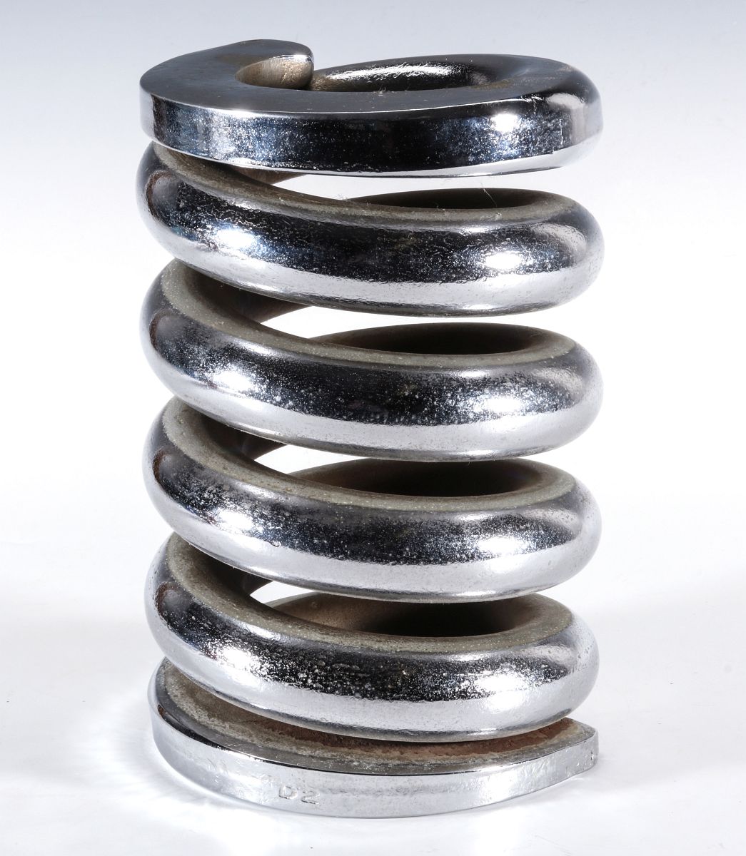 A CHROMED STEEL MODEL OF A RAIL CAR COIL SPRING