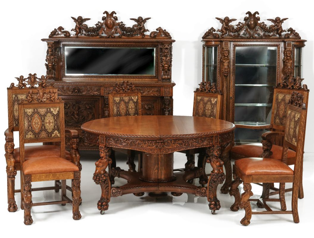 A HIGHLY CARVED AMERICAN OAK DINING SET ATTR HORNER