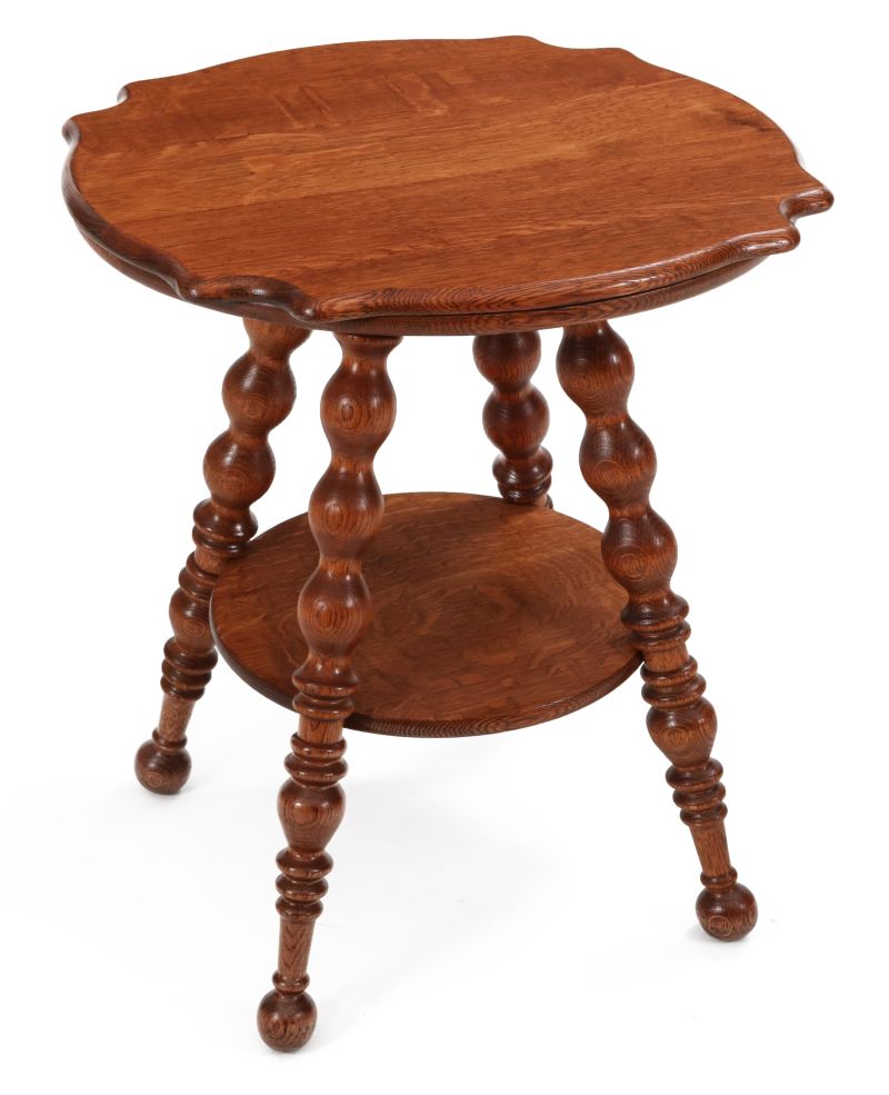 A CIRCA 1900 AMERICAN OAK TURTLE TOP LAMP TABLE