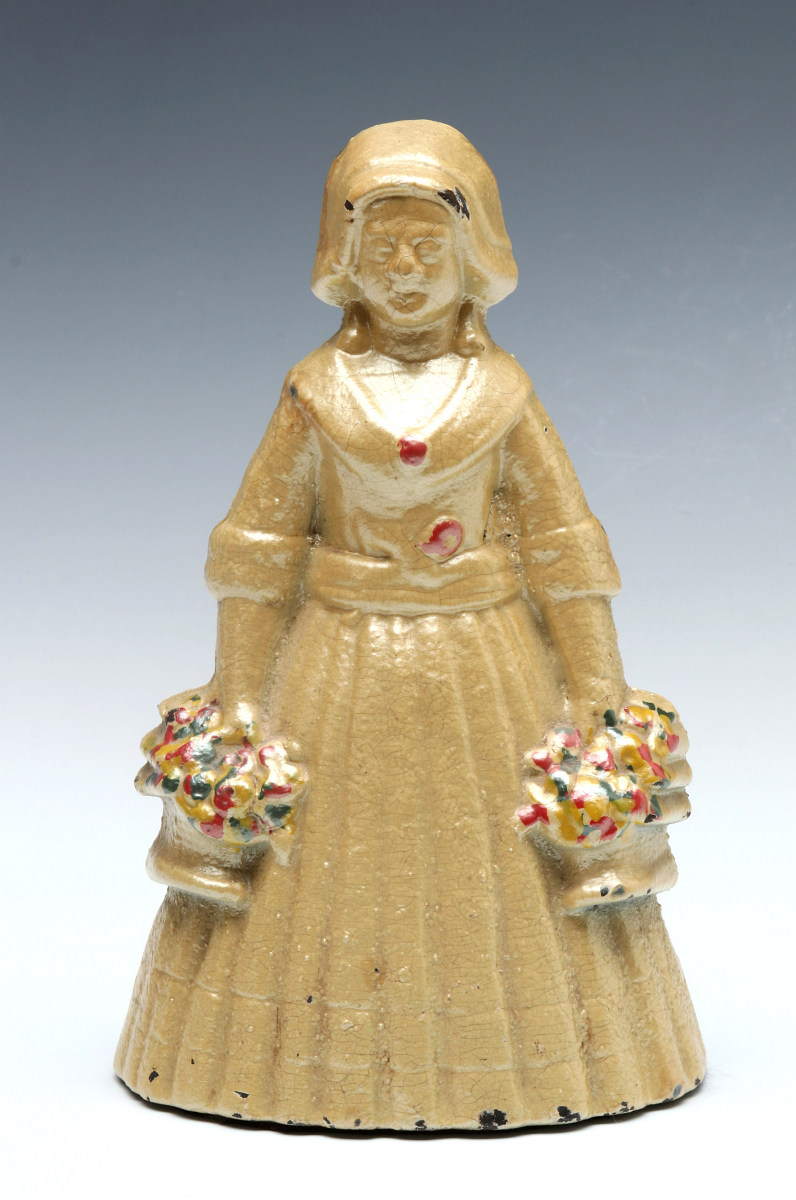 A JUDD CO. WOMAN W/ BASKETS DOORSTOP NO. 1270