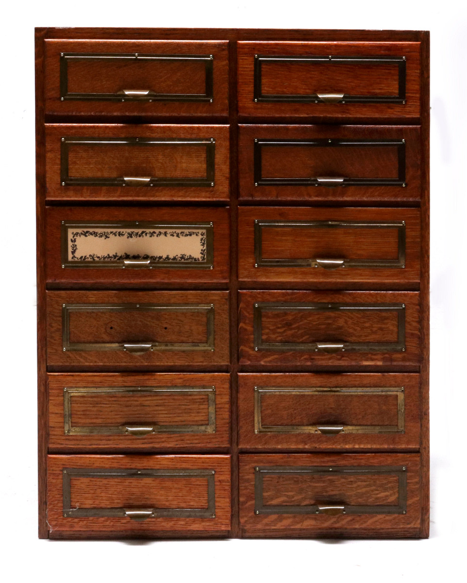 A NICE OAK TWELVE DRAWER FILE SYSTEM CABINET