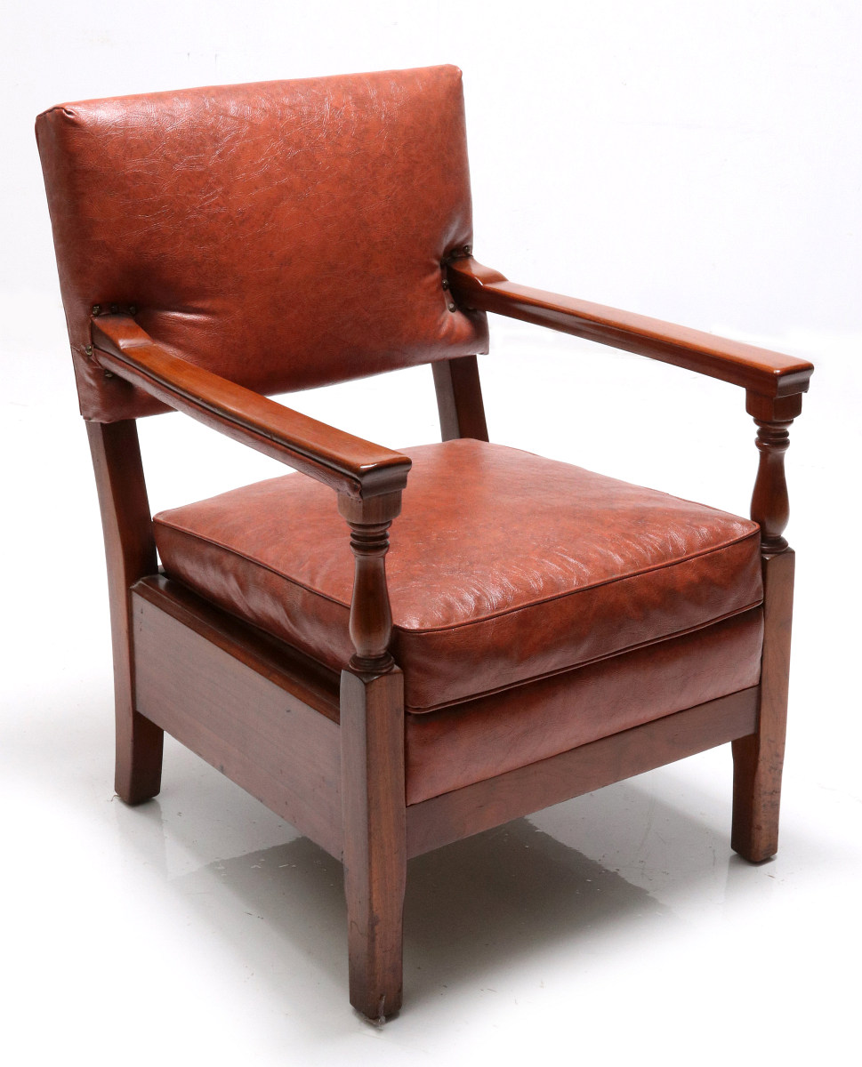 A LEATHER RAIL CAR CLUB CHAIR, ATTRIBUTED PULLMAN