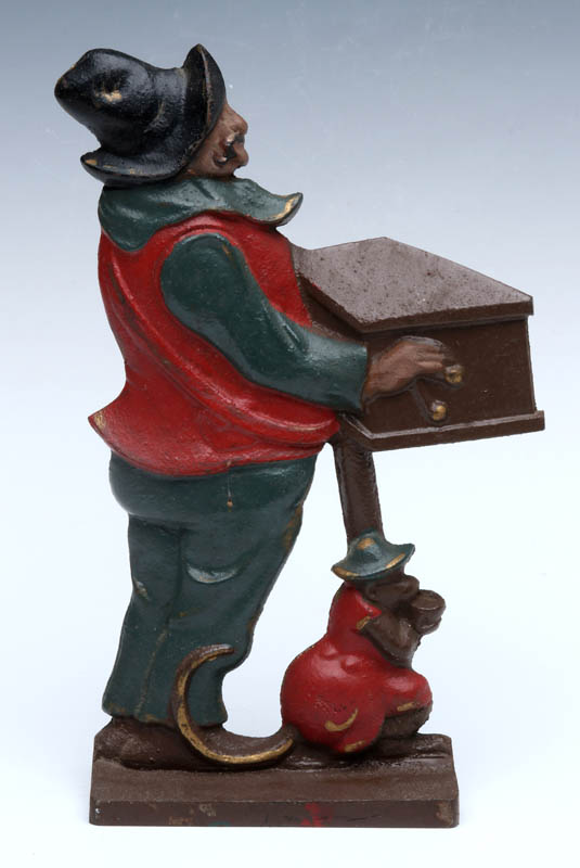 A CAST IRON ORGAN GRINDER AND MONKEY DOORSTOP