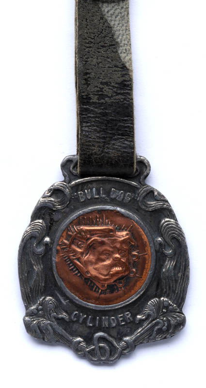 A FANCY 'BULL DOG CYLINDER' ADVERTISING WATCH FOB