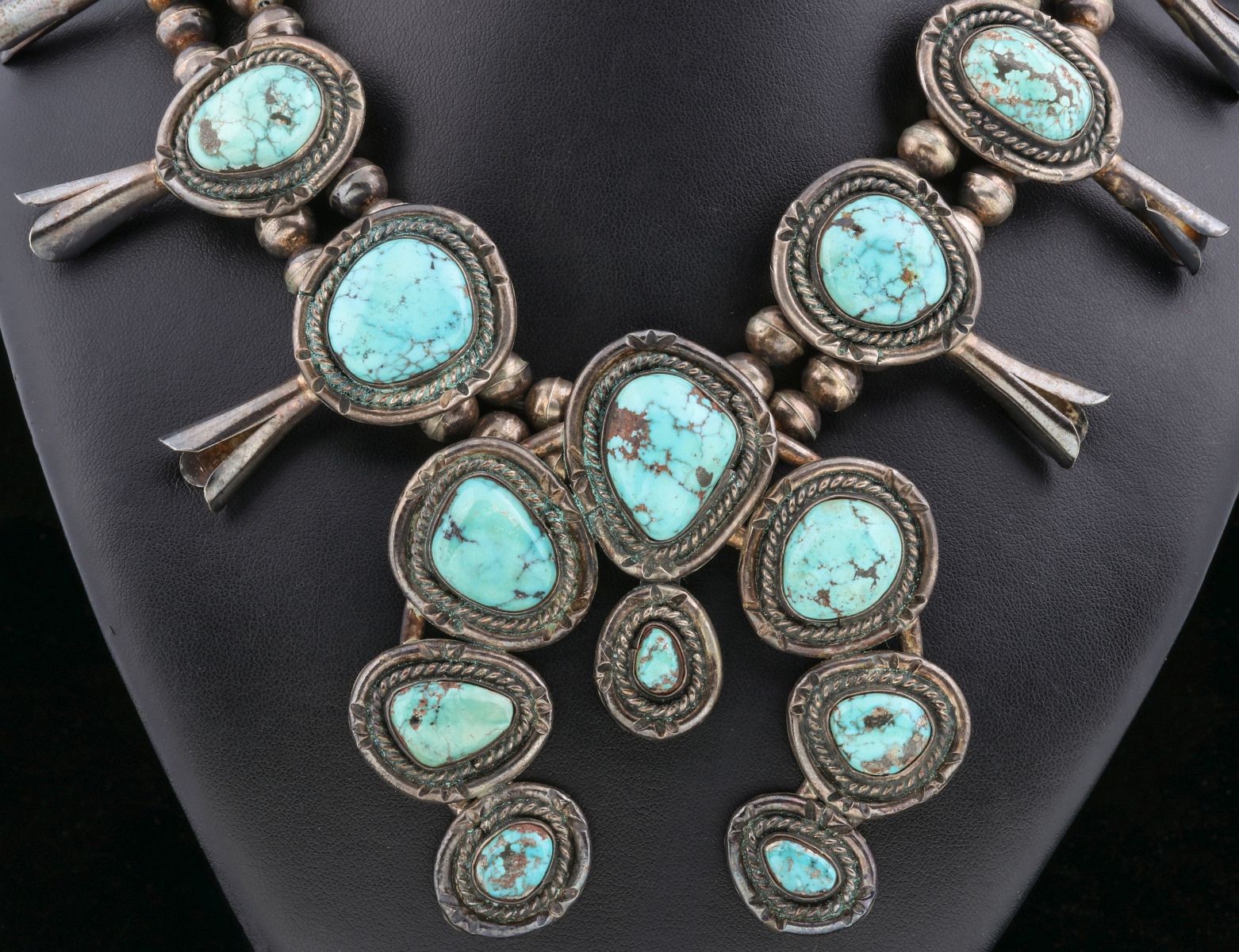 A STERLING SQUASH BLOSSOM NECKLACE W/ TURQUOISE