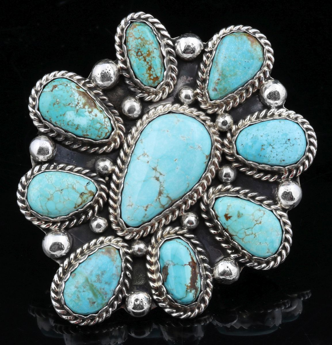 A TURQUOISE CLUSTER RING SIGNED AUGUSTINE LARGO