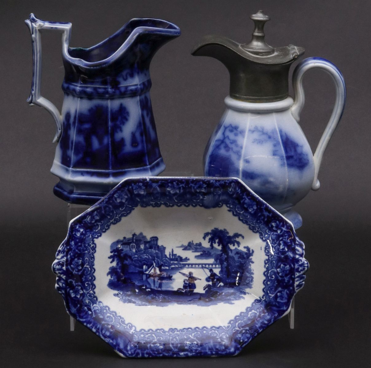 A COLLECTION OF FLOW BLUE SERVING PIECES