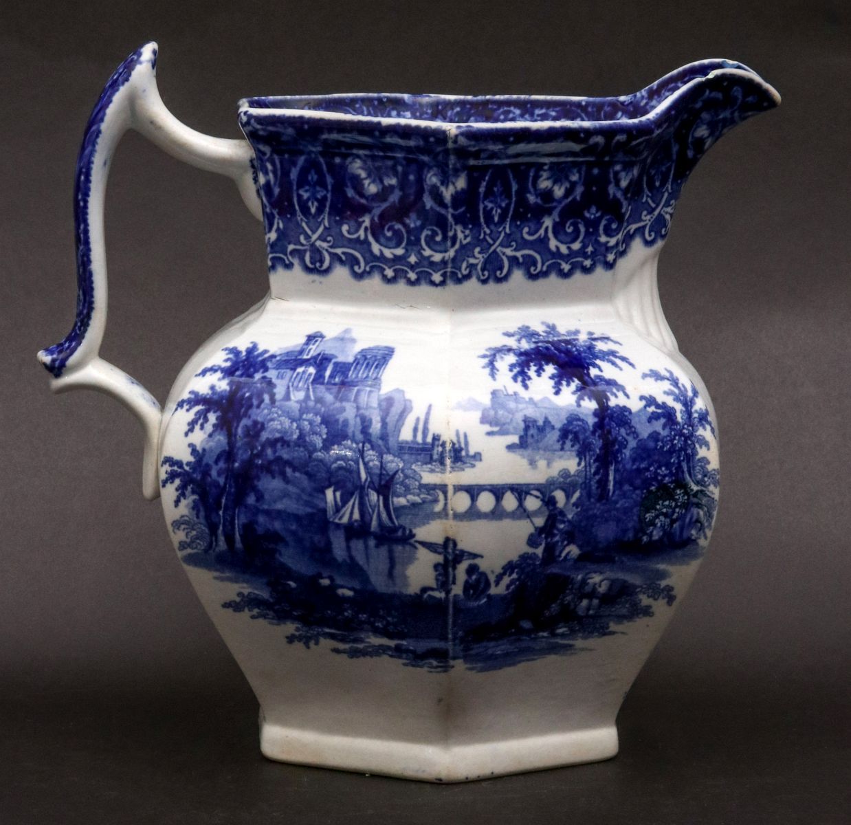 A TIVOLI PATTERN FLOW BLUE IRONSTONE PITCHER