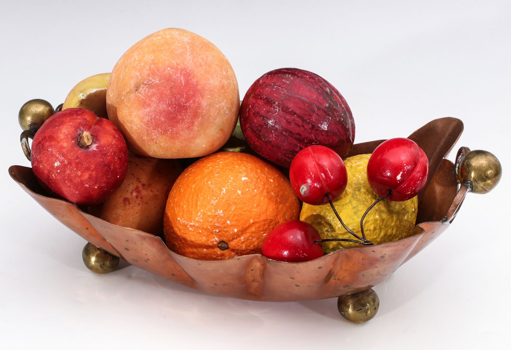 A COLLECTION OF VINTAGE CARVED STONE FRUIT