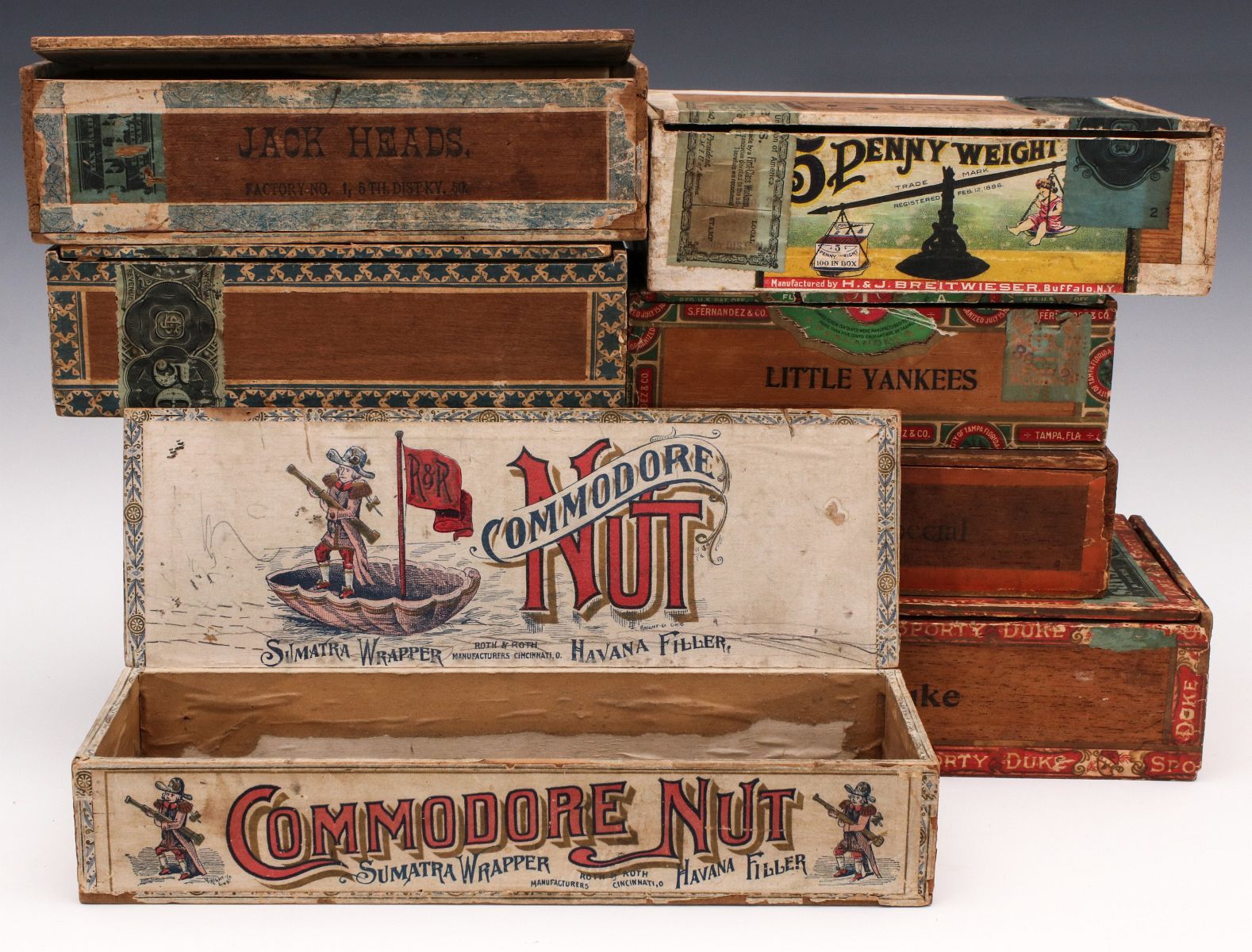 A COLLECTION OF SEVEN GOOD MAHOGANY CIGAR BOXES