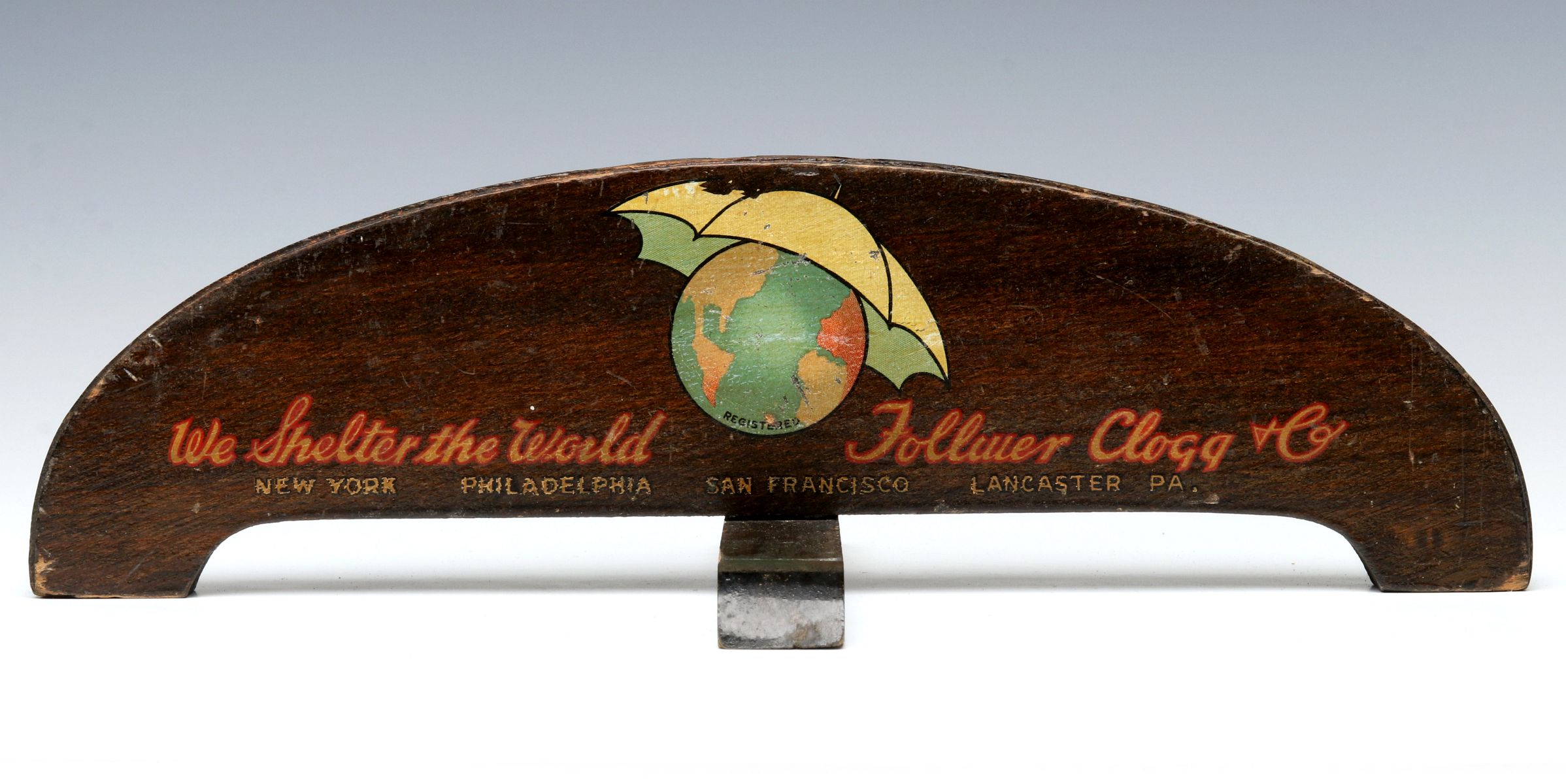 A CIRCA 1930s UMBRELLA ADVERTISING DISPLAY