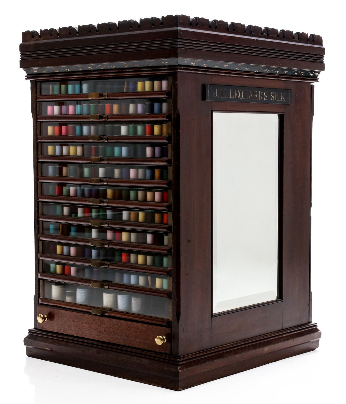 AN ORNATE J.N. LEONARD'S VICTORIAN SPOOL CABINET