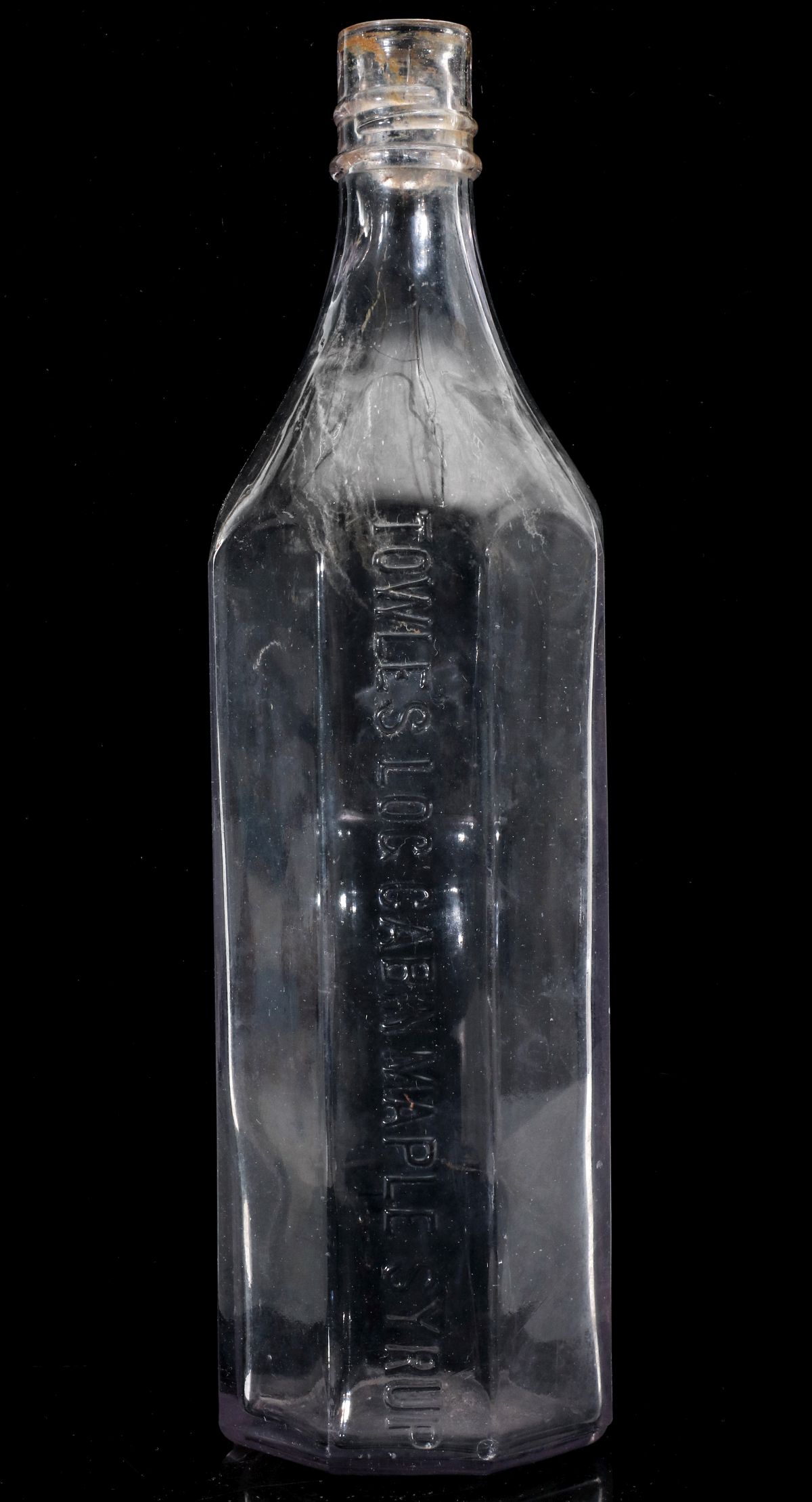 AN EARLY EIGHT-SIDED LOG CABIN SYRUP BOTTLE