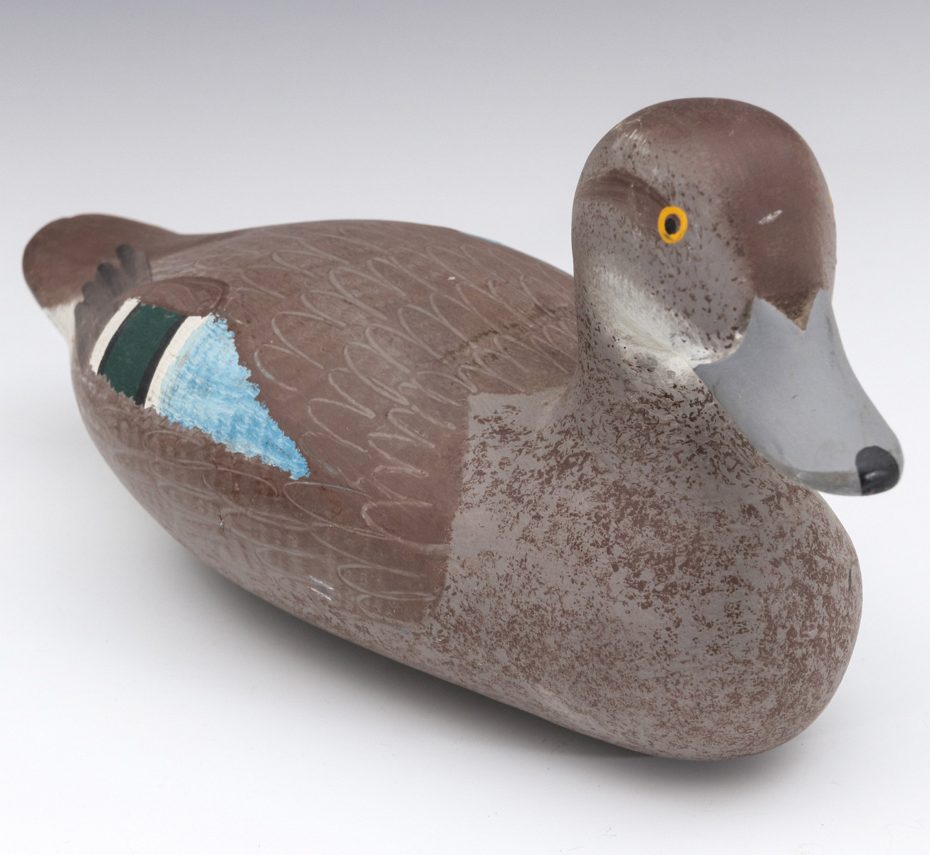 A BLUEBILL HEN WOOD DECOY SIGNED CLARENCE BAUER