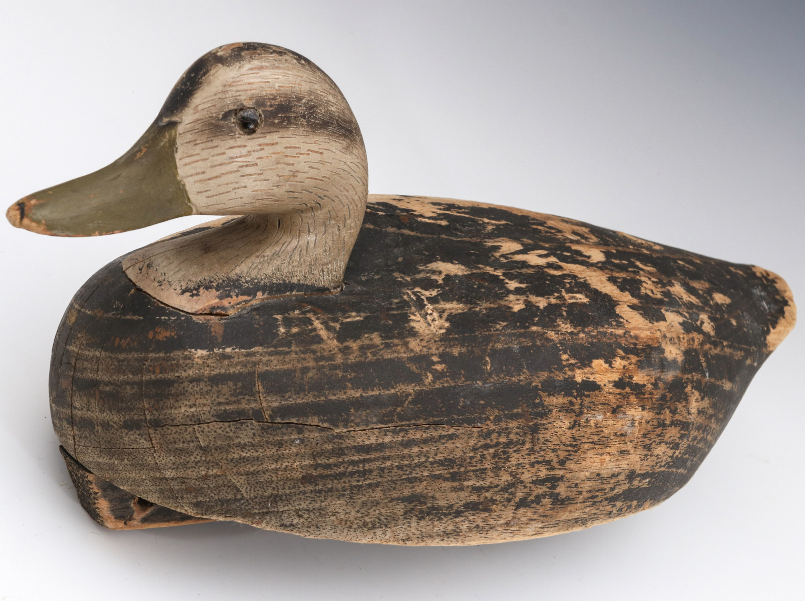 AN ANTIQUE CARVED WOOD HEN BLACK DUCK DECOY