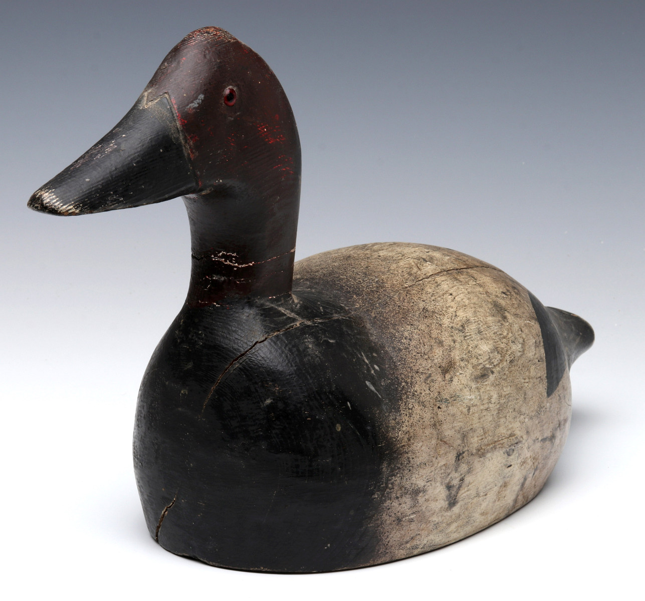 A CANVASBACK DRAKE WOODEN DECOY