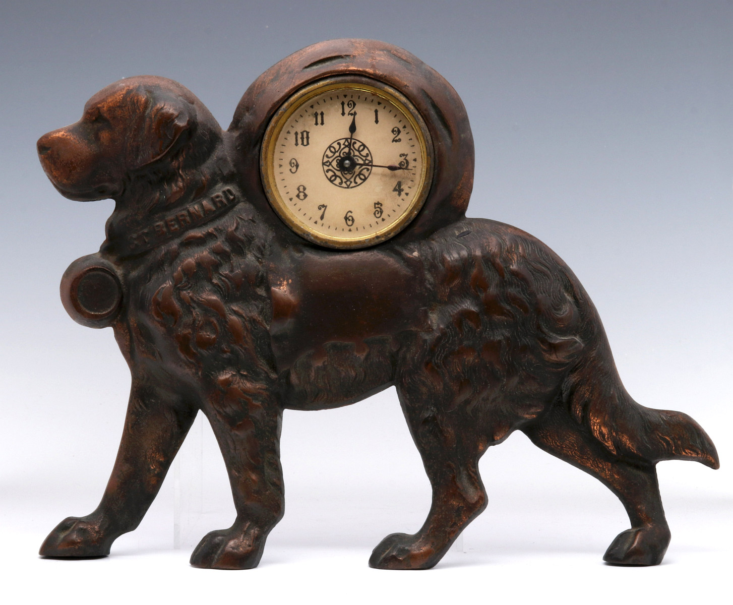 AN EARLY 20TH CENT CAST IRON ST. BERNARD CLOCK