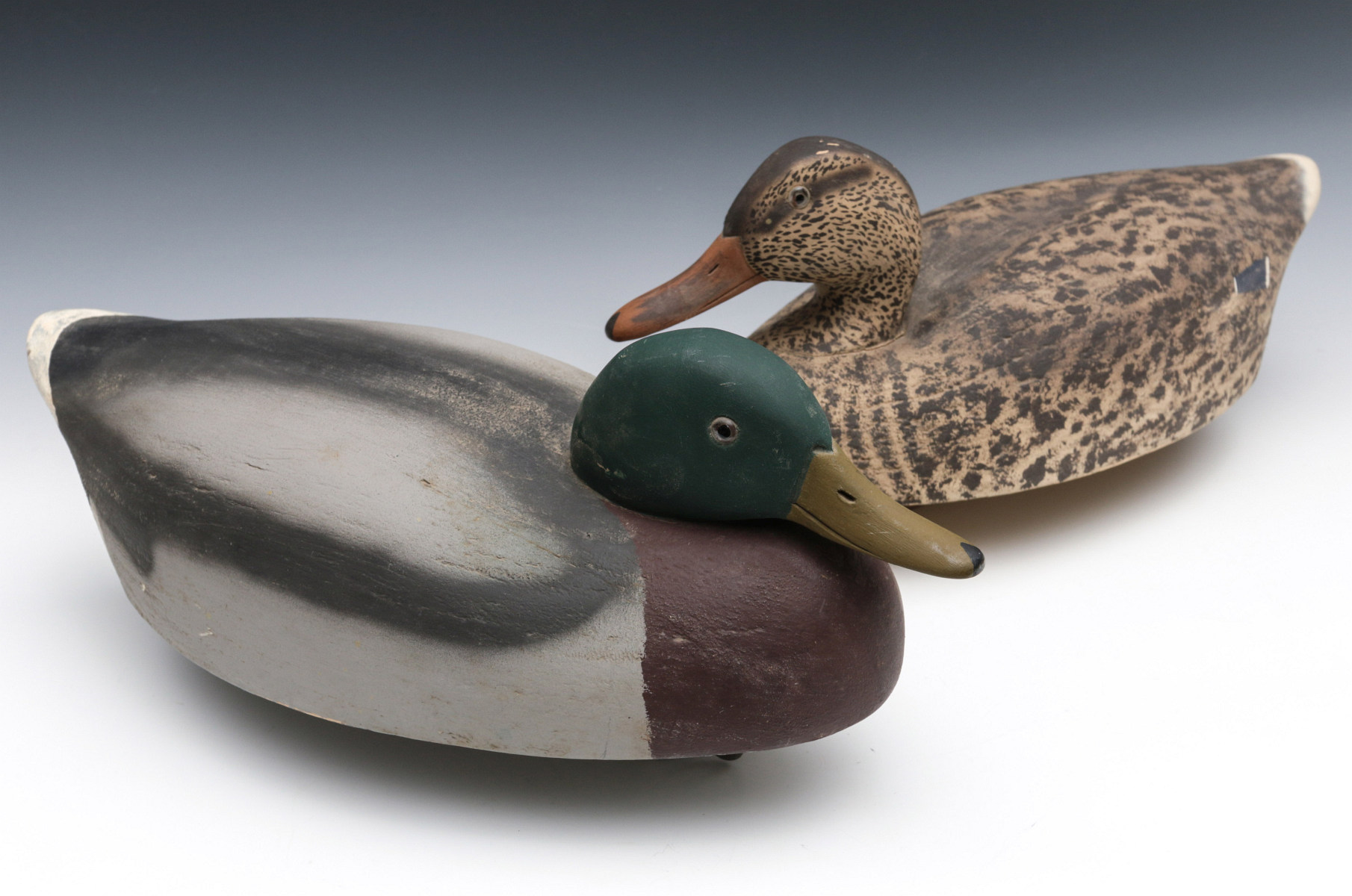 A MALLARD HEN AND DRAKE WOODEN DECOY PAIR