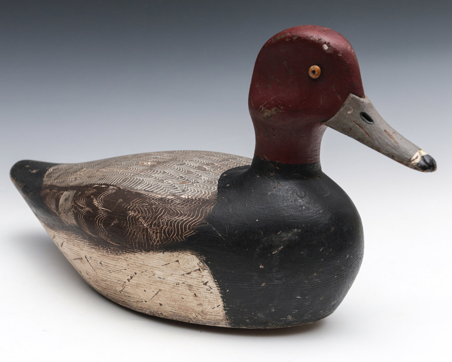 A REDHEAD DRAKE WOOD DECOY BRANDED H. STEVENS