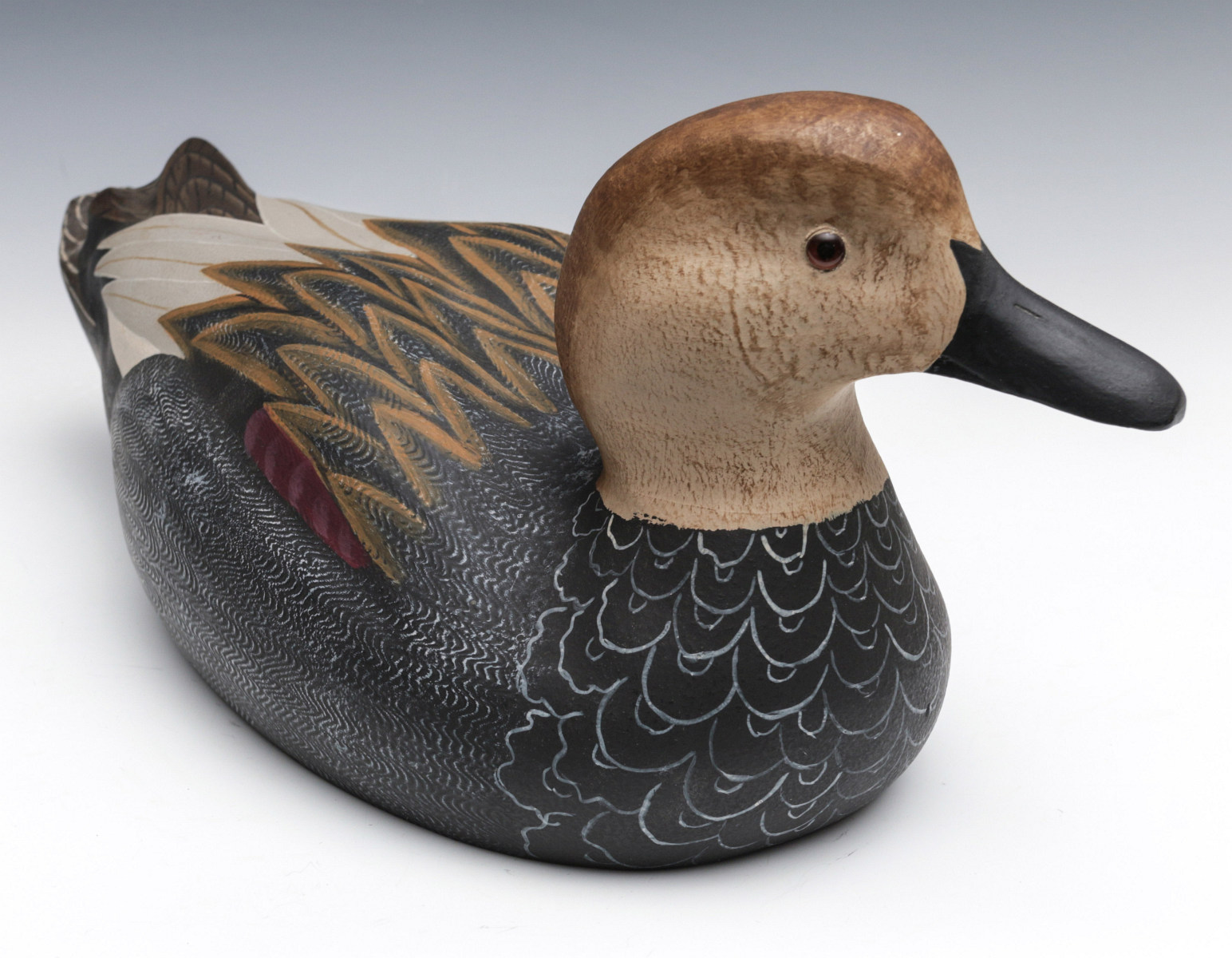 A LATE 20TH CENTURY GADWALL HEN WOODEN DECOY