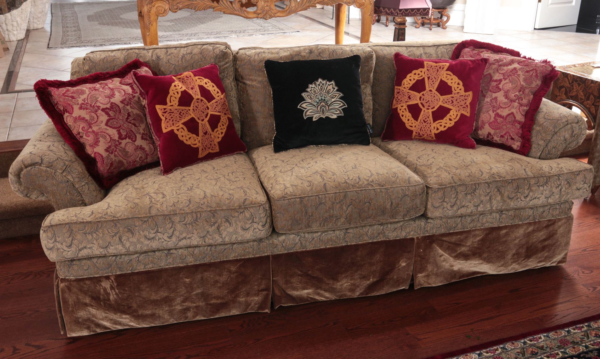 A THREE CUSHION SOFA IN CUT VELVET TYPE UPHOLSTERY