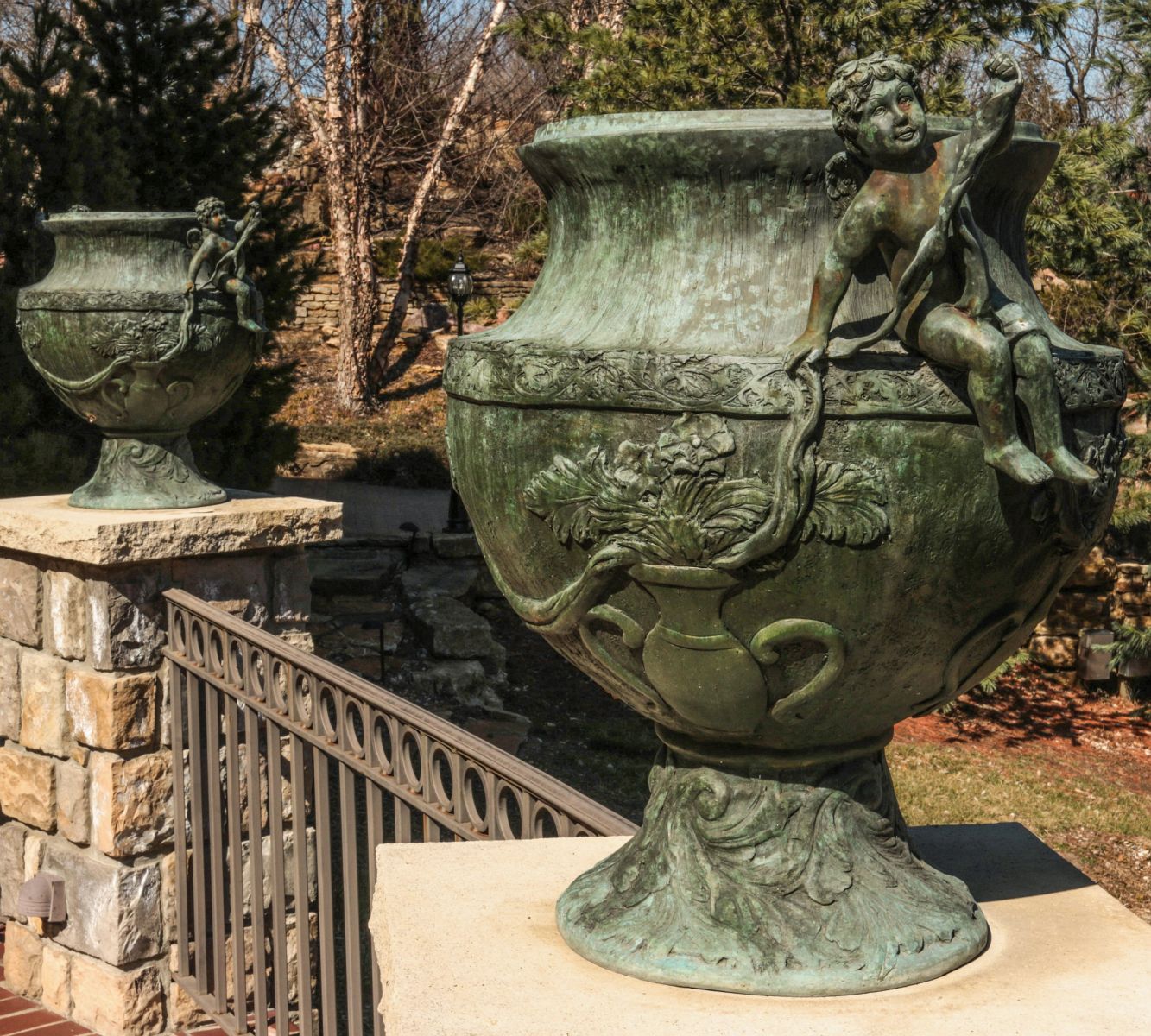 A GRAND PAIR 20TH C. BRONZE GARDEN URNS W/ CHERUBS