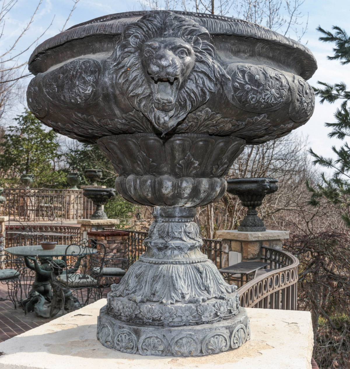 THREE 20TH C. PEDESTAL GARDEN URNS W/ LION'S HEADS