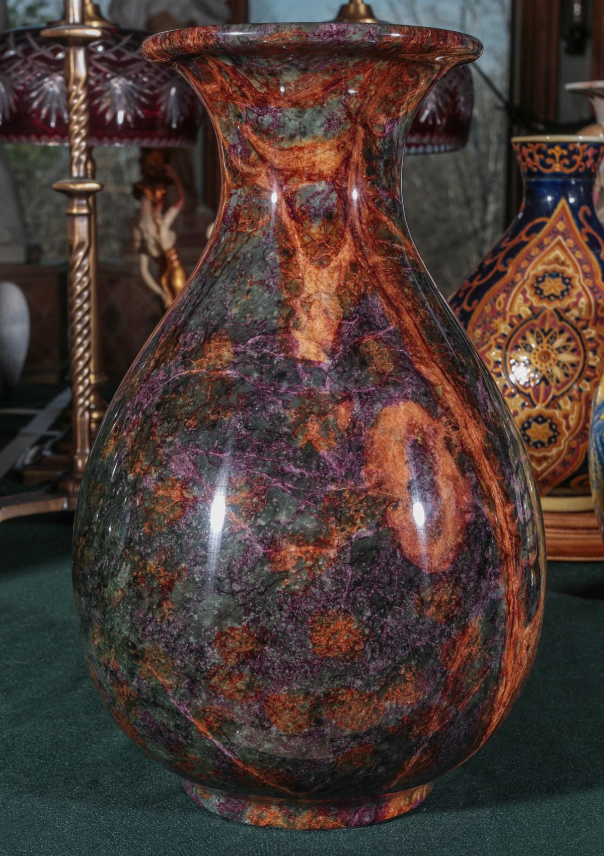 A SERPENTINE JADE SEVEN COLOR POLISHED STONE VASE