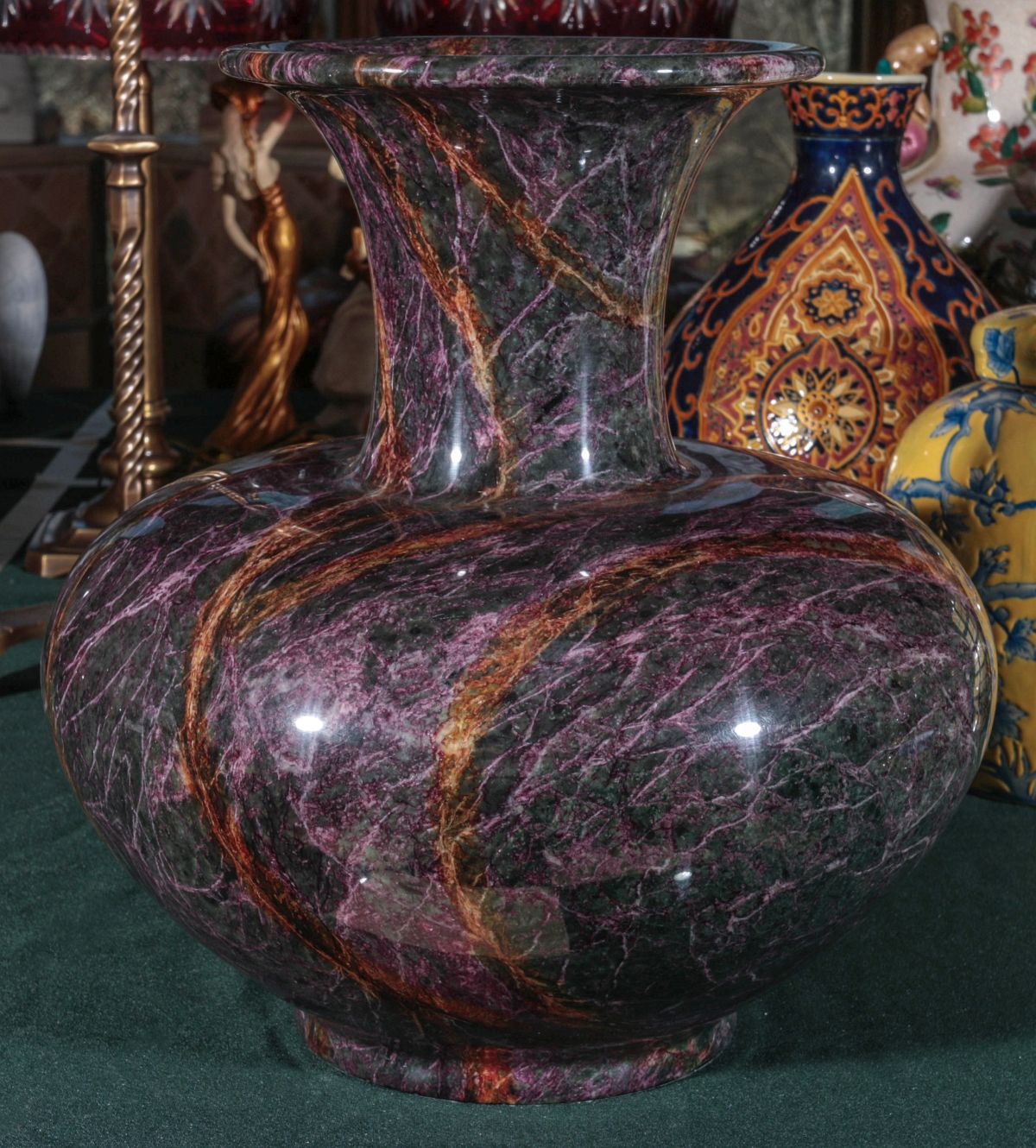 A SERPENTINE JADE SEVEN COLOR POLISHED STONE VASE