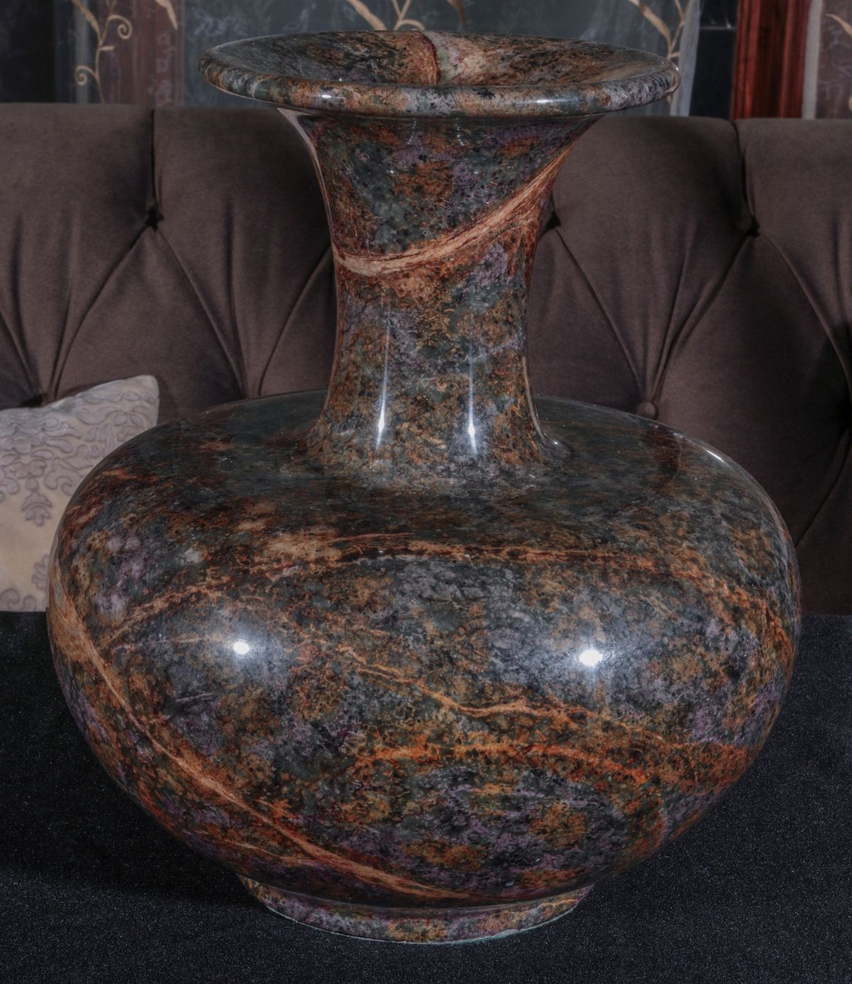 A SERPENTINE JADE SEVEN COLOR POLISHED STONE VASE